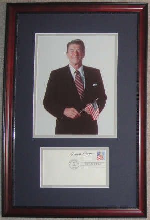 <font size=3>Ronald Reagan Holding an American Flag Display with Signed First Day Cover (FDC)</font>