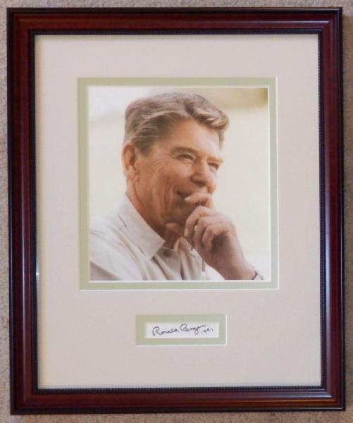 Ronald Reagan Color Photo In Thought Display with Signature Cut Dated 1991